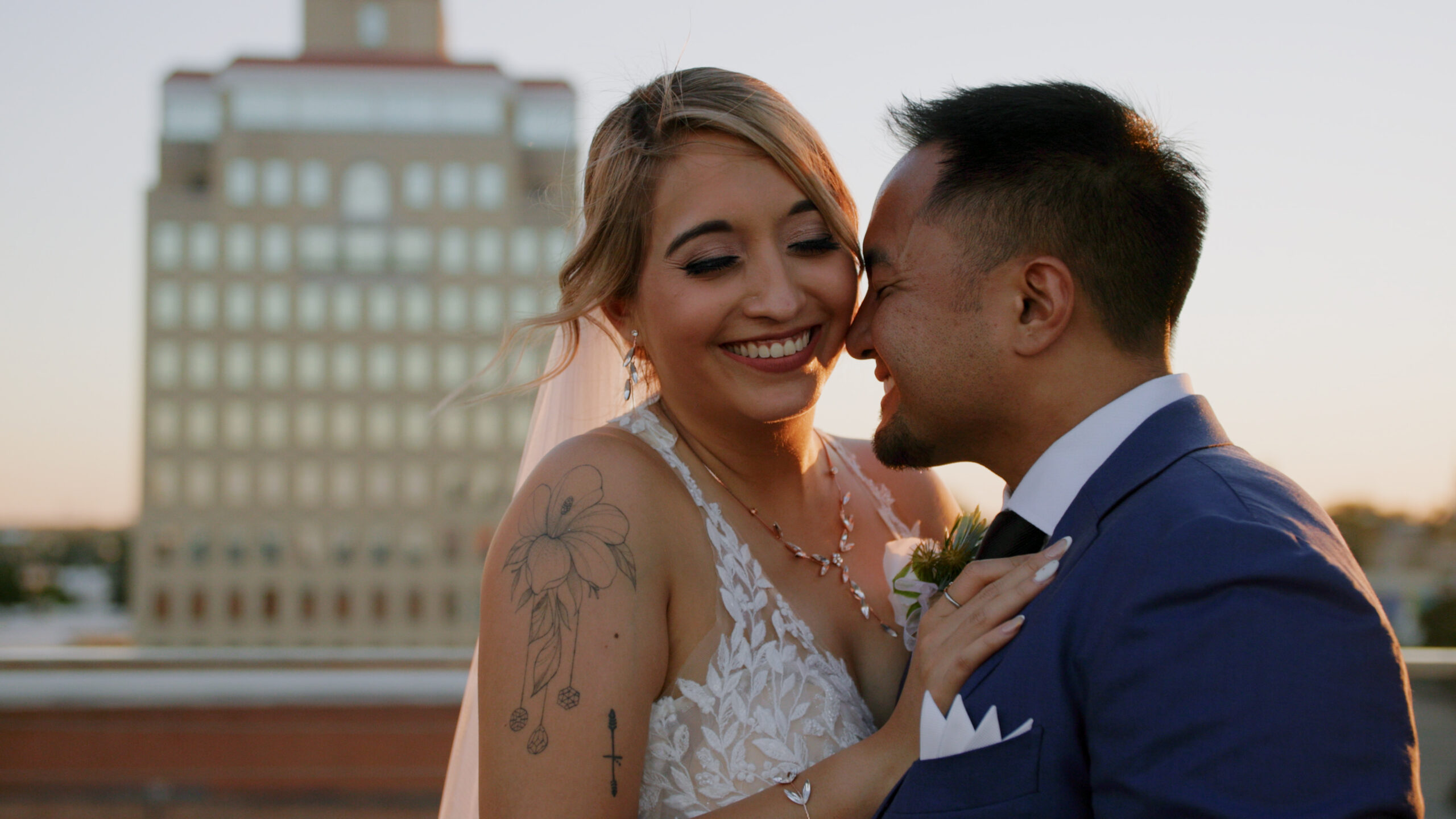 Maribel and JP on Anthem Stories rooftop at sunset in Waco Texas